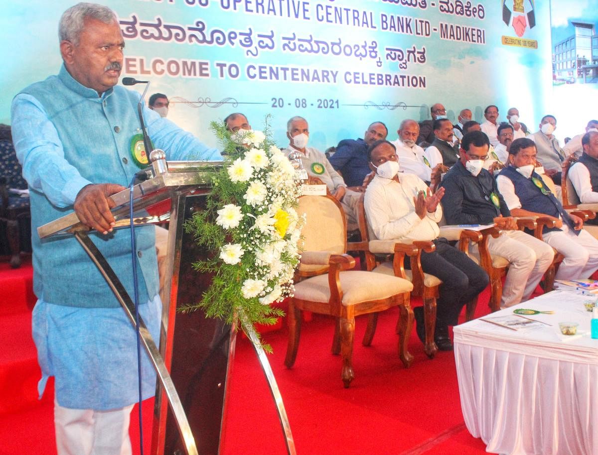 Cooperation Minister S T Somashekar speaks after laying the foundation stone for the centenary building of the District Cooperative Central Bank in Madikeri.