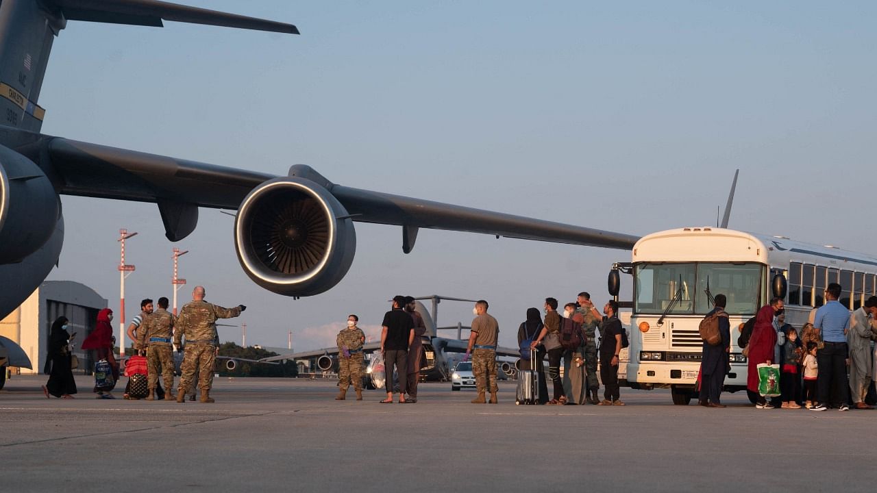 There were numerous accounts of some struggling to reach and enter the airport, some impeded by Taliban fighters who now control Kabul. Credit: AFP Photo