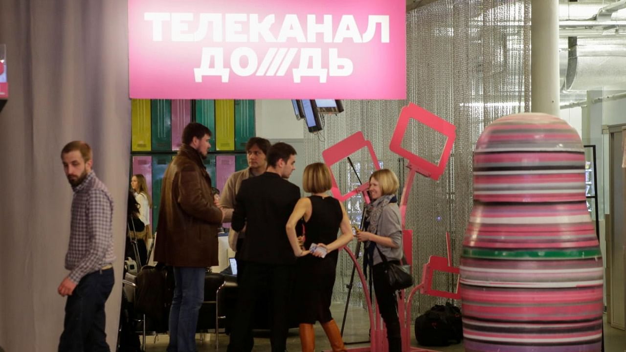 Journalists chat in the offices of independent Russian news channel Dozhd (TV Rain) after a news conference in Moscow. Credit: Reuters Photo
