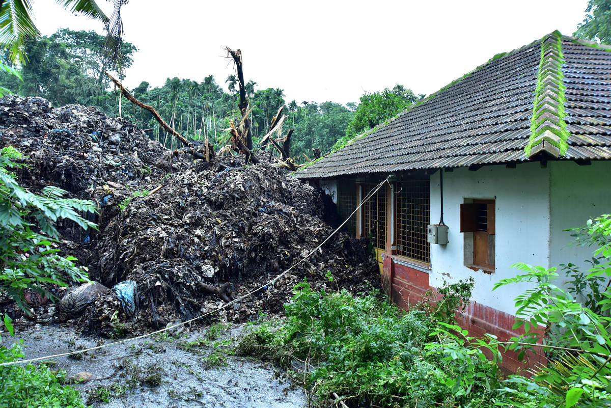 Heaps of garbage that slid and entered a house in Pacchanady. Credit: DH file photo