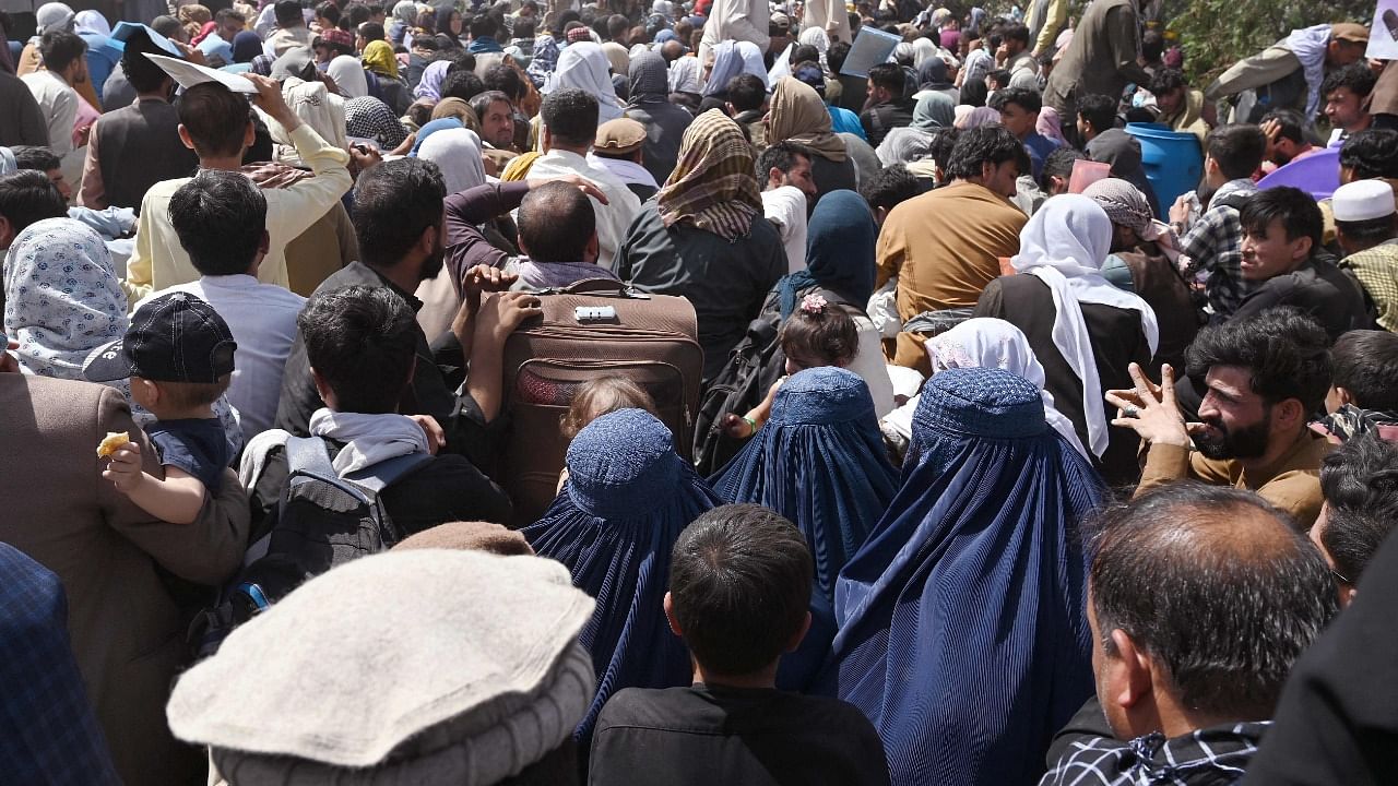 Crowds of people gathered at the Kabul airport. Credit: AFP File Photo