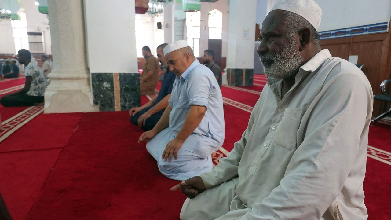 Muslim men praying at the Sufi mosque in Tripoli's coastal city of Zliten. Credit: AFP Photo