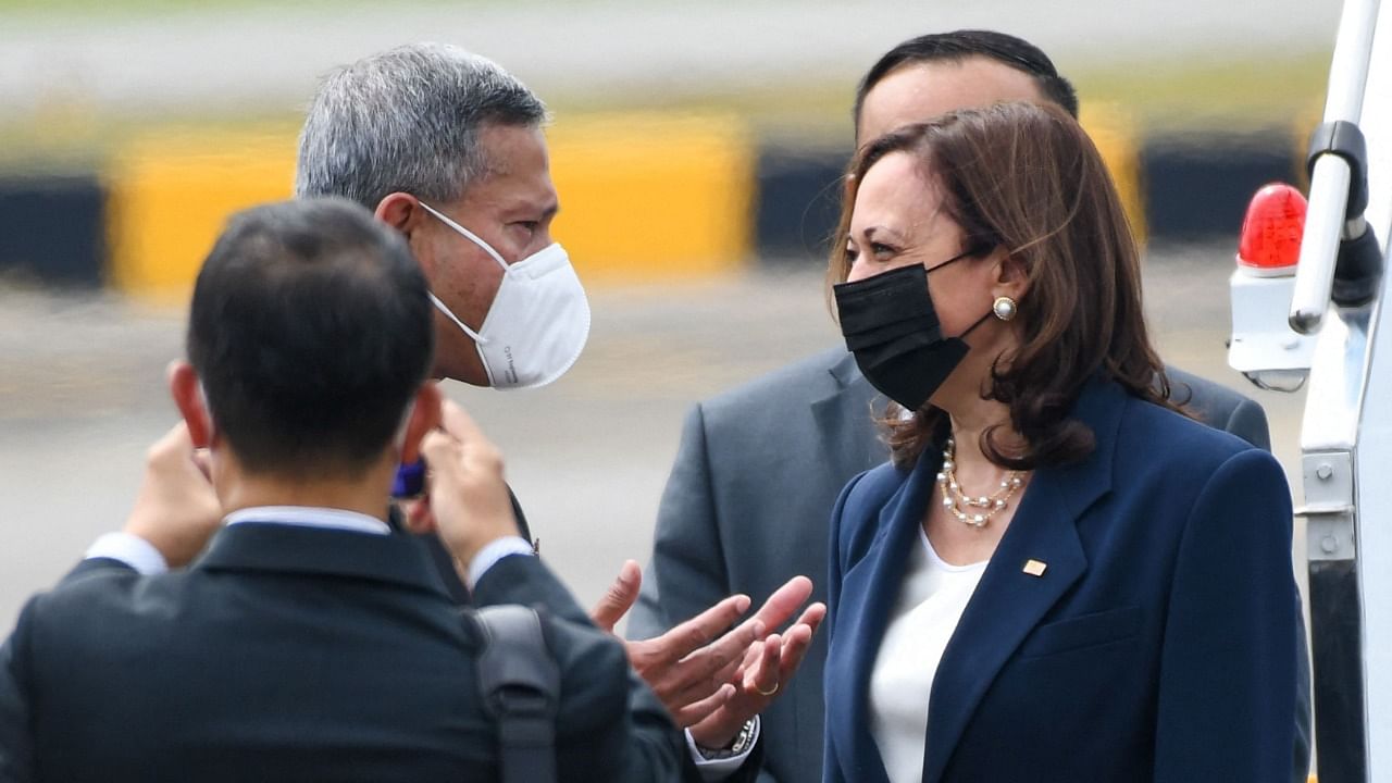 US Vice President Kamala Harris (R) is greeted by Singapore Foreign Minister Vivian Balakrishnan (L) upon her arrival. Credit: AFP Photo