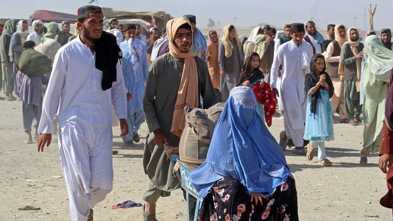 Afghan nationals arrive to return back to Afghanistan at the Pakistan-Afghanistan border crossing point in Chaman. Credit: AFP Photo