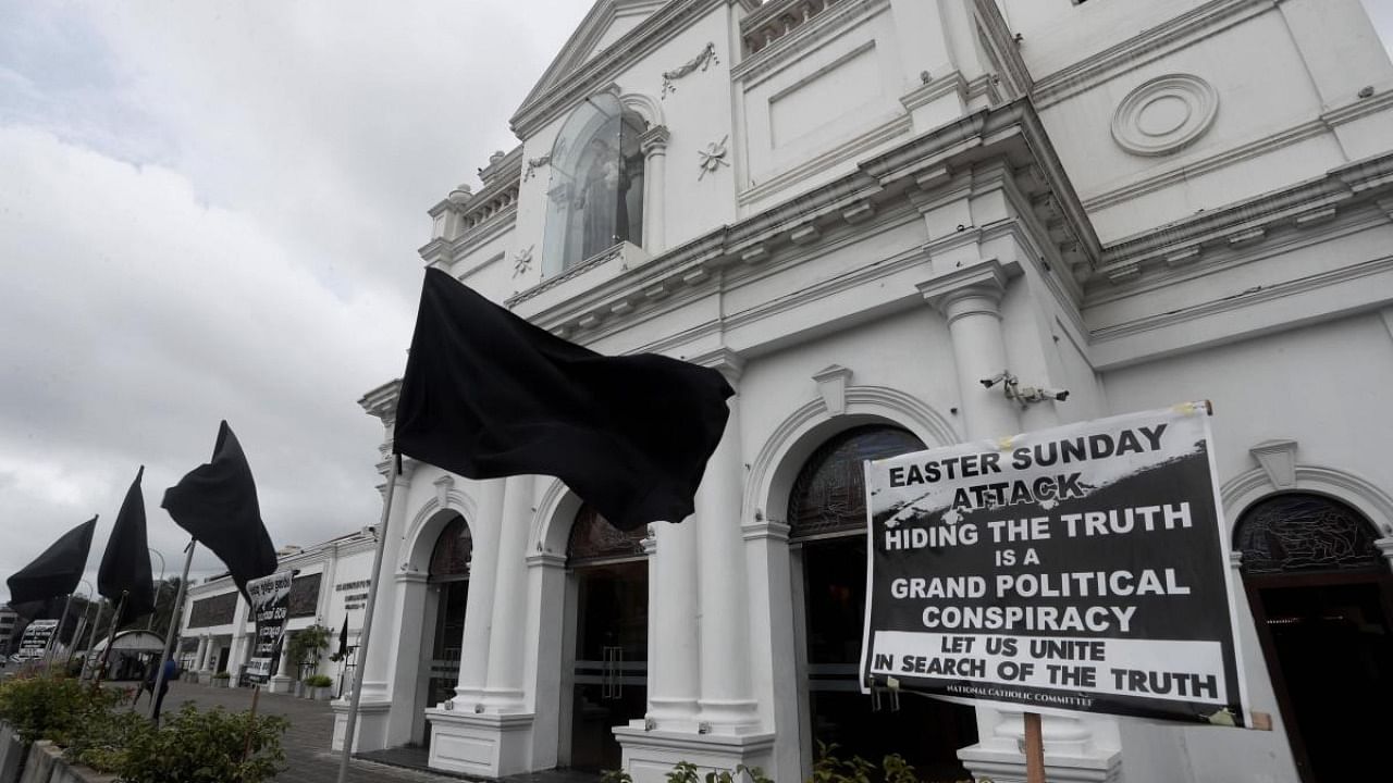 Sri Lankan Catholics hoisted black flags in churches and at homes on Saturday protesting against what they call government‚Äôs inaction to find the true conspirators in the Easter Sunday blasts of 2019 which killed 269 people. Credit: AP Photo