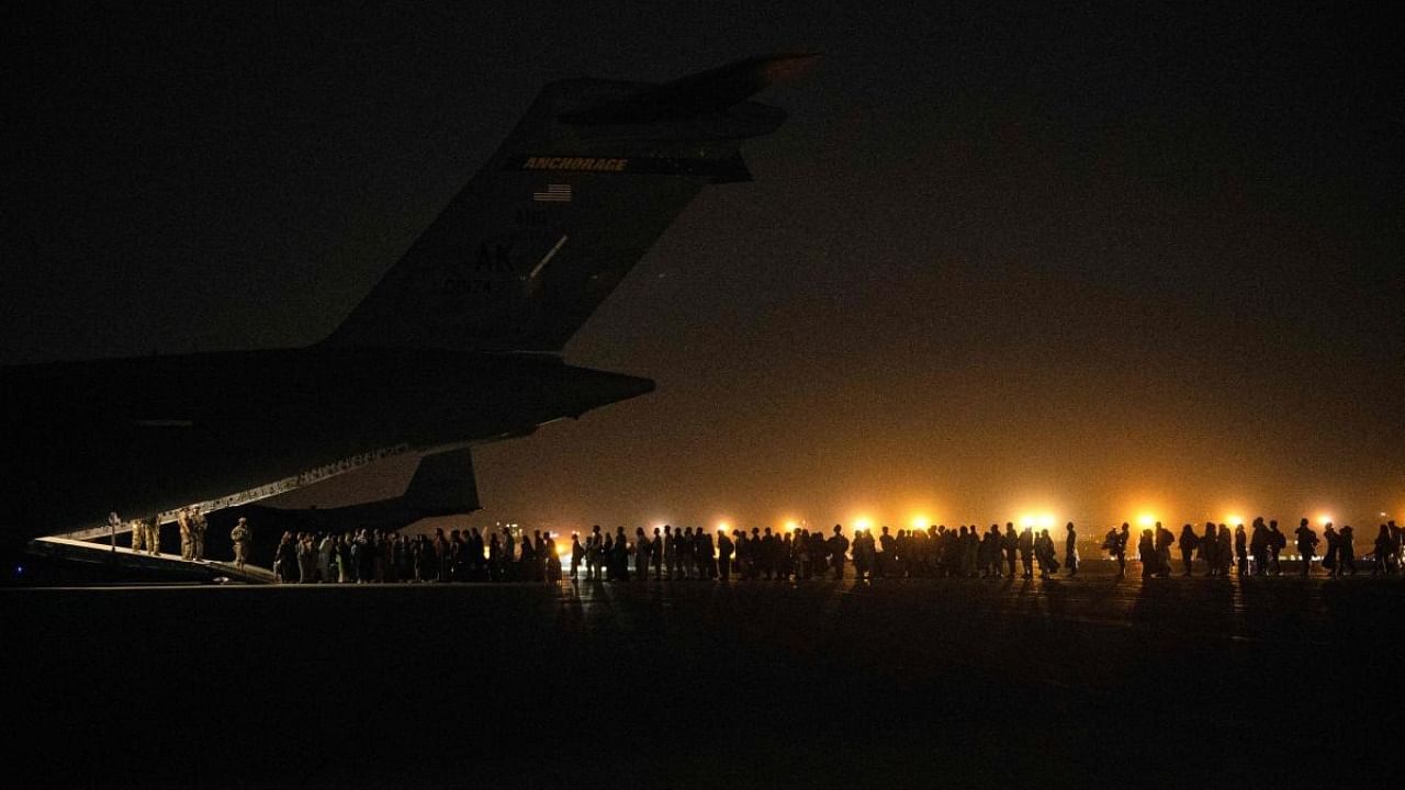 Afghans civilians are evacuated by the US military. Credit: AFP Photo