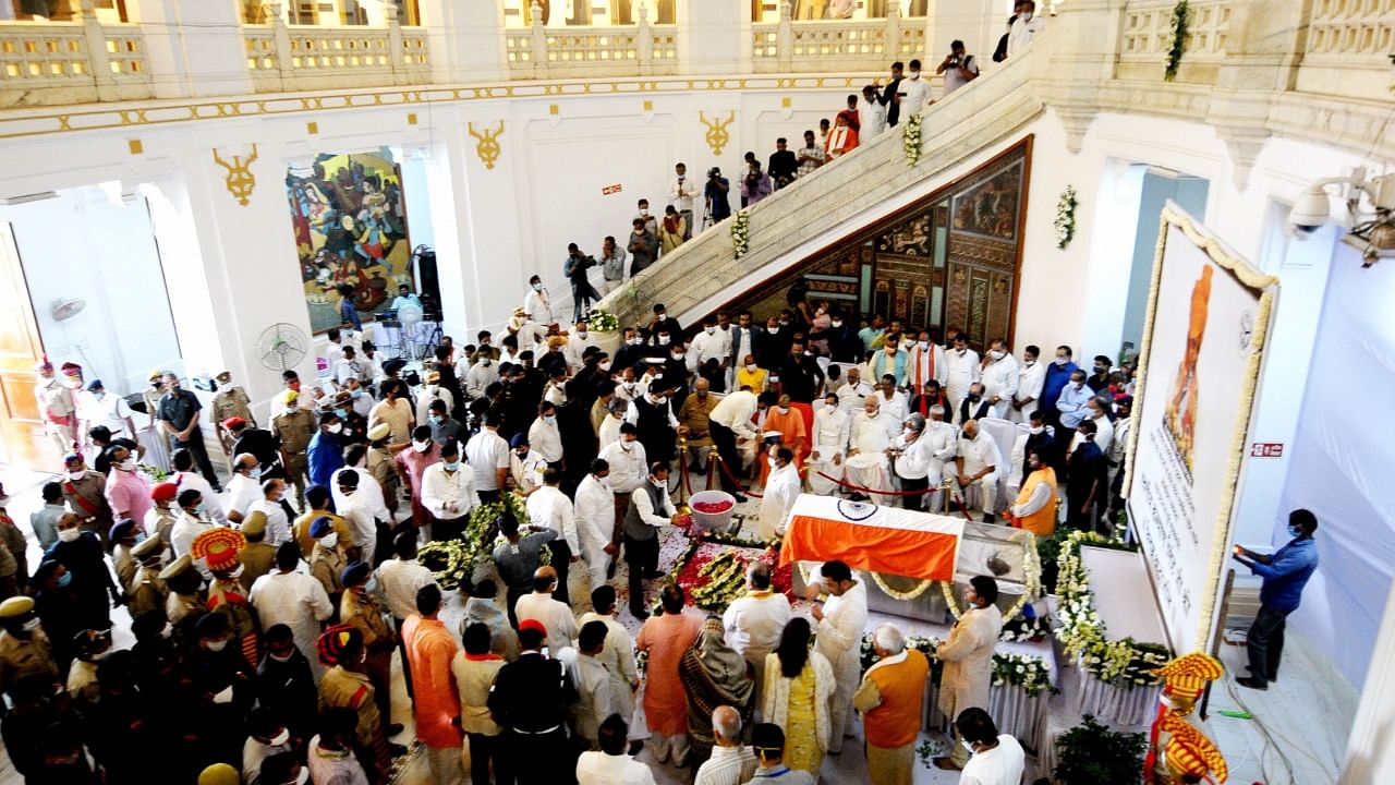 People pay last respect to senior BJP leader and former Rajasthan Governor Kalyan Singh, who died on Saturday due to sepsis and multi organs failure, during his funeral at Vidhan Bhawan in Lucknow, Sunday, August 22, 2021. Credit: PTI Photo