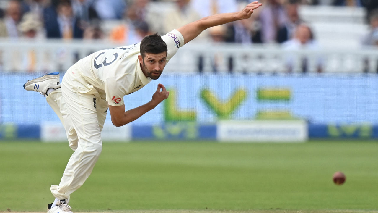 England's Mark Wood bowls on the fifth and final day of the second cricket Test match between England and India at Lord's cricket ground. Credit: AFP Photo