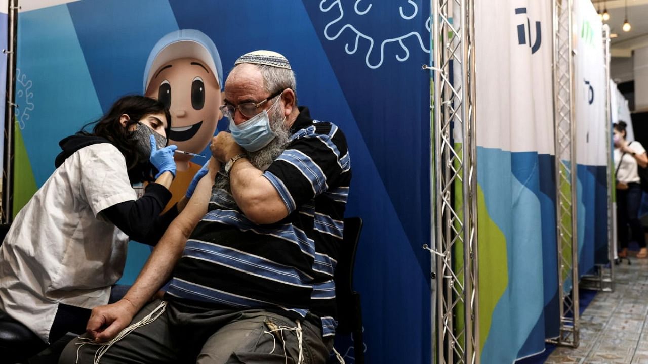 A man receives his third dose of the coronavirus disease (Covid-19) vaccine in Jerusalem. Credit: Reuters Photo