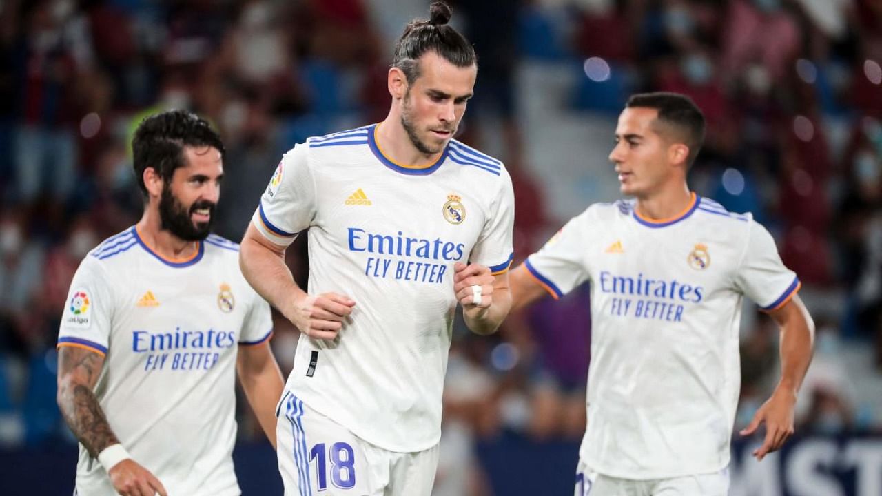 Real Madrid's Welsh forward Gareth Bale (C) celebrates scoring the opening goal during the Spanish League football match between Levante UD and Real Madrid CF at the Ciutat de Valencia stadium in Valencia. Credit: AFP Photo