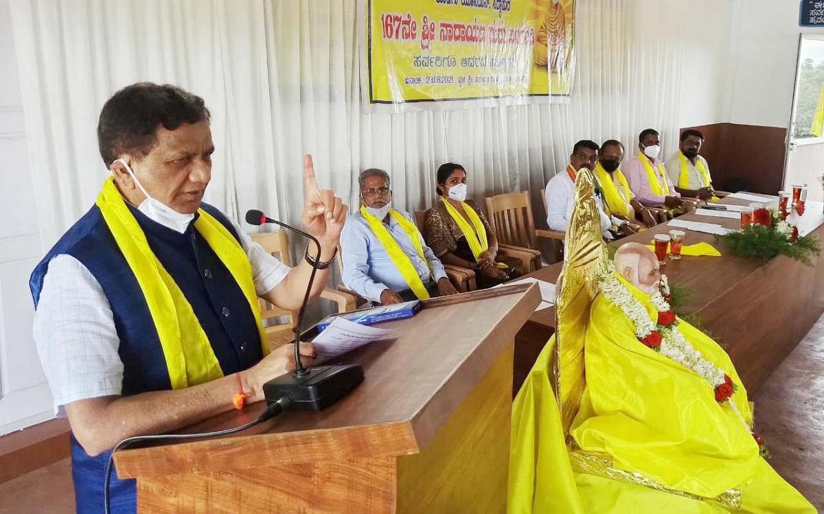 Virajpet MLA K G Bopaiah speaks during a Narayana Guru Jayanthi programme in Siddapura on Monday.