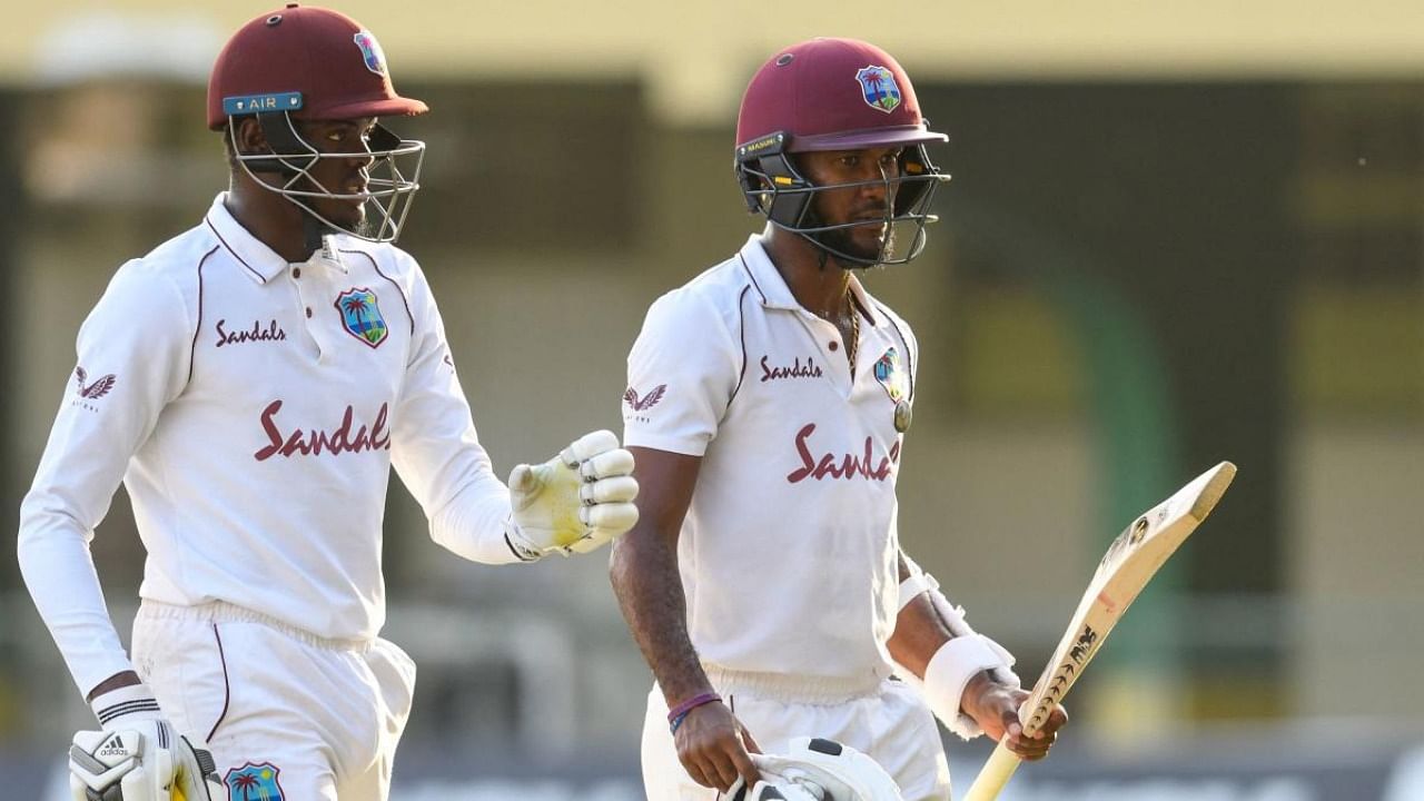 Alzarri Joseph (L) and Kraigg Brathwaite (R) of West Indies walk off the field at the end of day 4 of the 2nd Test between West Indies and Pakistan at Sabina Park, Kingston, Jamaica. Credit: AFP Photo