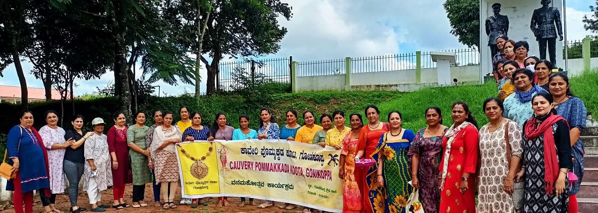 Cauvery Kodava Pommakkada Koota members observe Vanamahotsava in Gonikoppa on Tuesday.