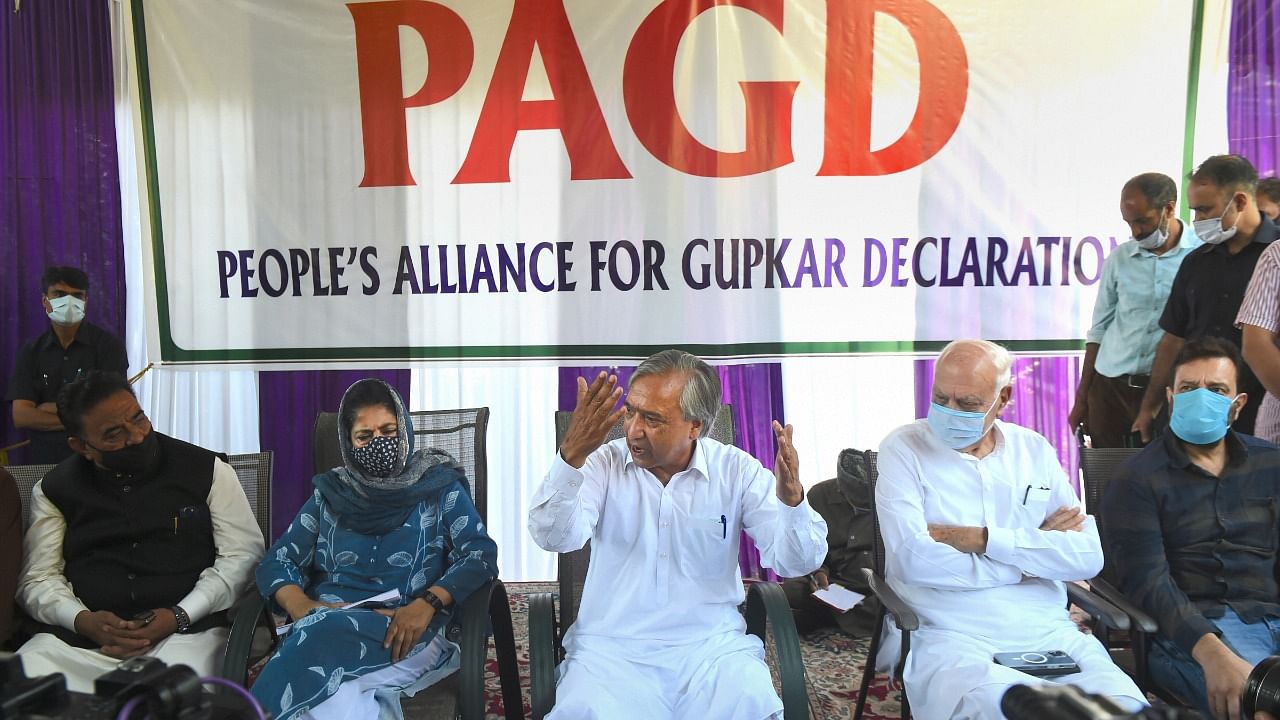 People's Alliance for Gupkar Declaration (PAGD) Spokesman M Y Tarigami with National Conference President Farooq Abdullah (R), Peoples Democratic Party (PDP) President Mehbooba Mufti (L) addressing a press conference after a meeting, in Srinagar, Tuesday, August 24, 2021. Credit: PTI Photo