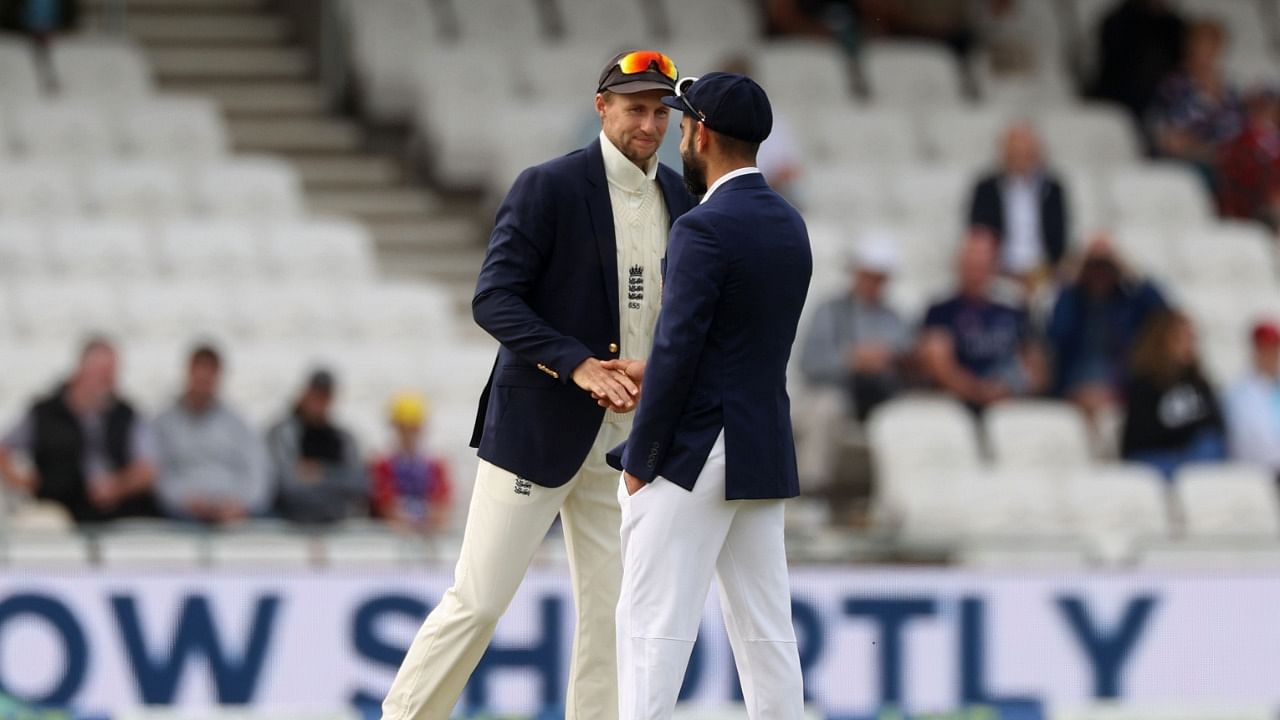 England skipper Joe Root (L) and India captain Virat Kohli ahead of the toss for the 3rd Test in Headlingley. Credit: Reuters Photo