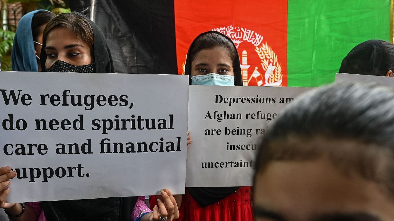 Afghans residing in India take part in a demonstration outside the UN Refugee Agency ( UNHCR) office in New Delhi. Credit: AFP Photo