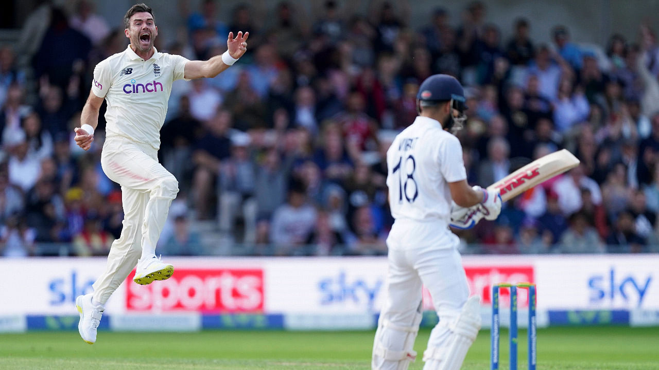England's James Anderson, left, celebrates the dismissal of India's captain Virat Kohli, right, during the first day of third test cricket match. Credit: AP Photo