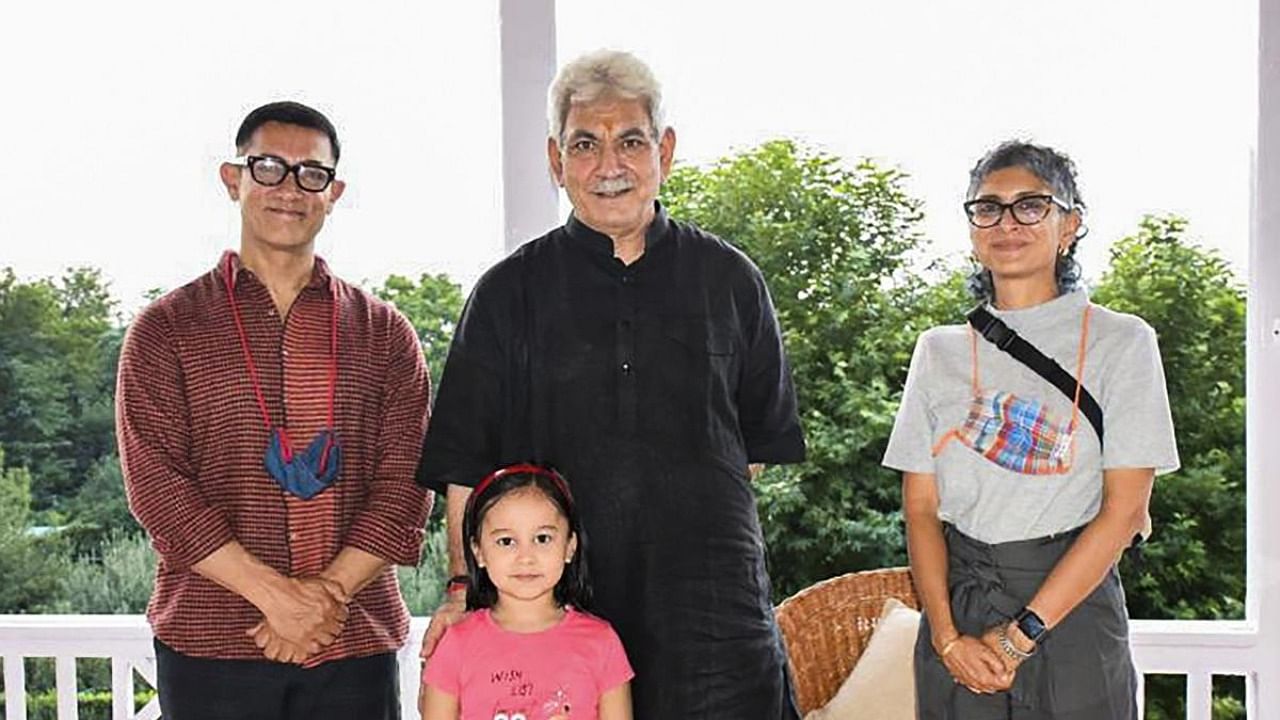 J&K LT Governor Manoj Sinha meets film actor Aamir Khan and Kiran Rao. Credit: PTI File Photo
