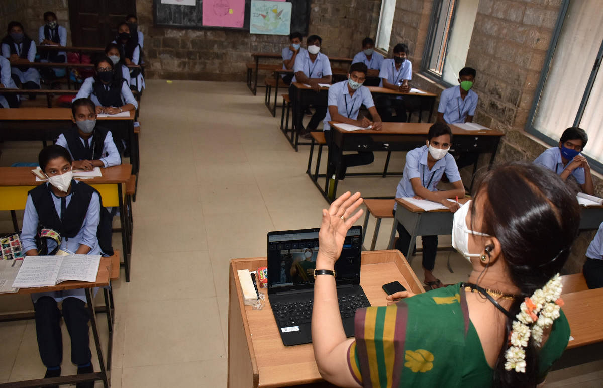 Classes on at a government school in Malleswaram. DH Photo/B K Janardhan