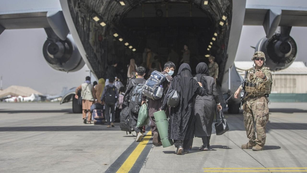 Evacuation of people from Kabul airport. Credit: AP File Photo