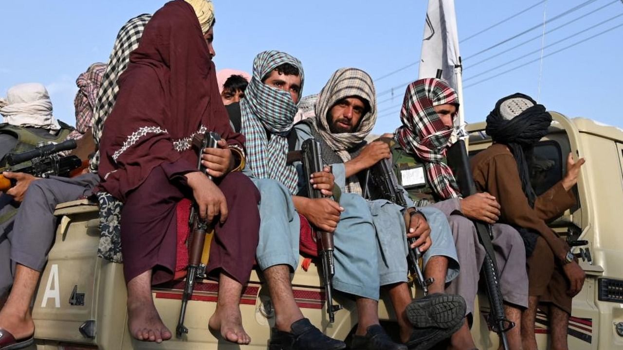 Taliban fighters in a vehicle patrol the streets of Kabul. Credit: AFP Photo