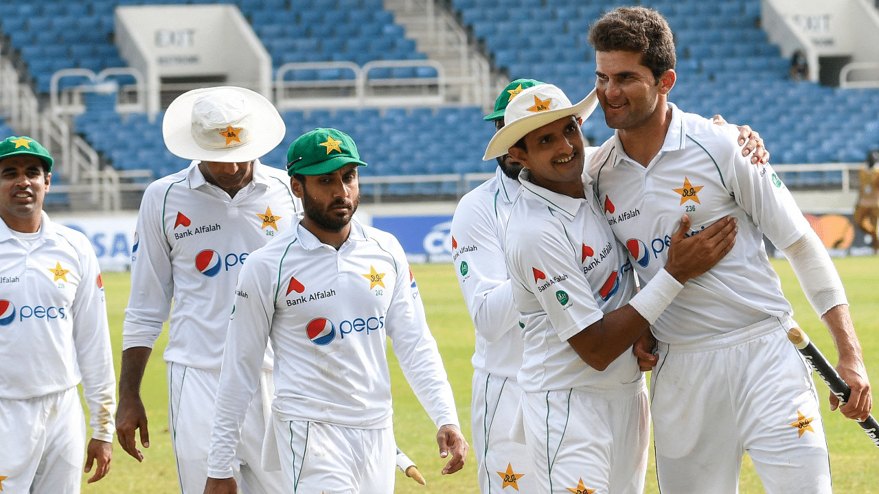 Shaheen Afridi (R) and Nauman Ali (2R) of Pakistan celebrate winning the 5th and final day of the 2nd Test. Credit: AFP Photo