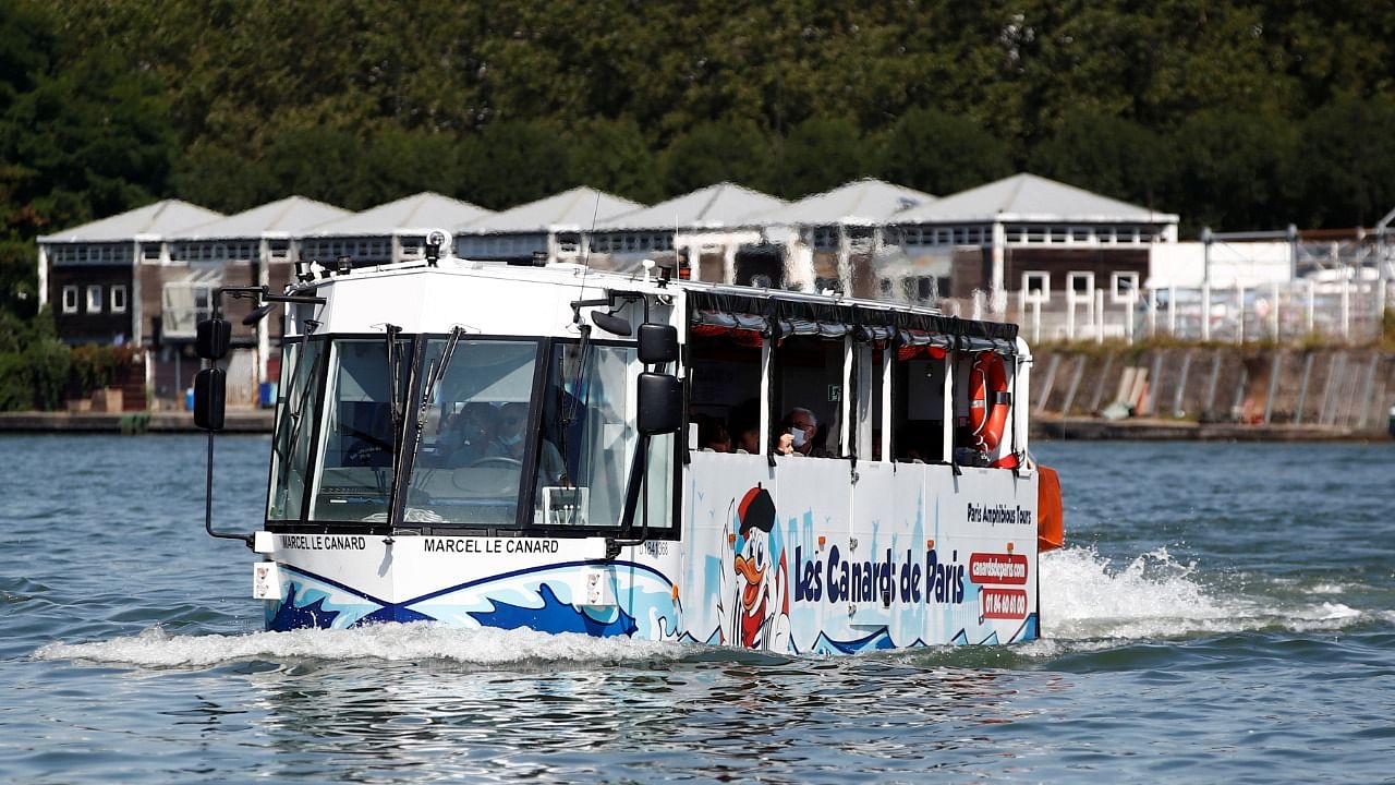 An amphibious bus named Marcel le Canard (Marcel The Duck) sails down the Seine river during a tour around Paris. Credit: Reuters Photo