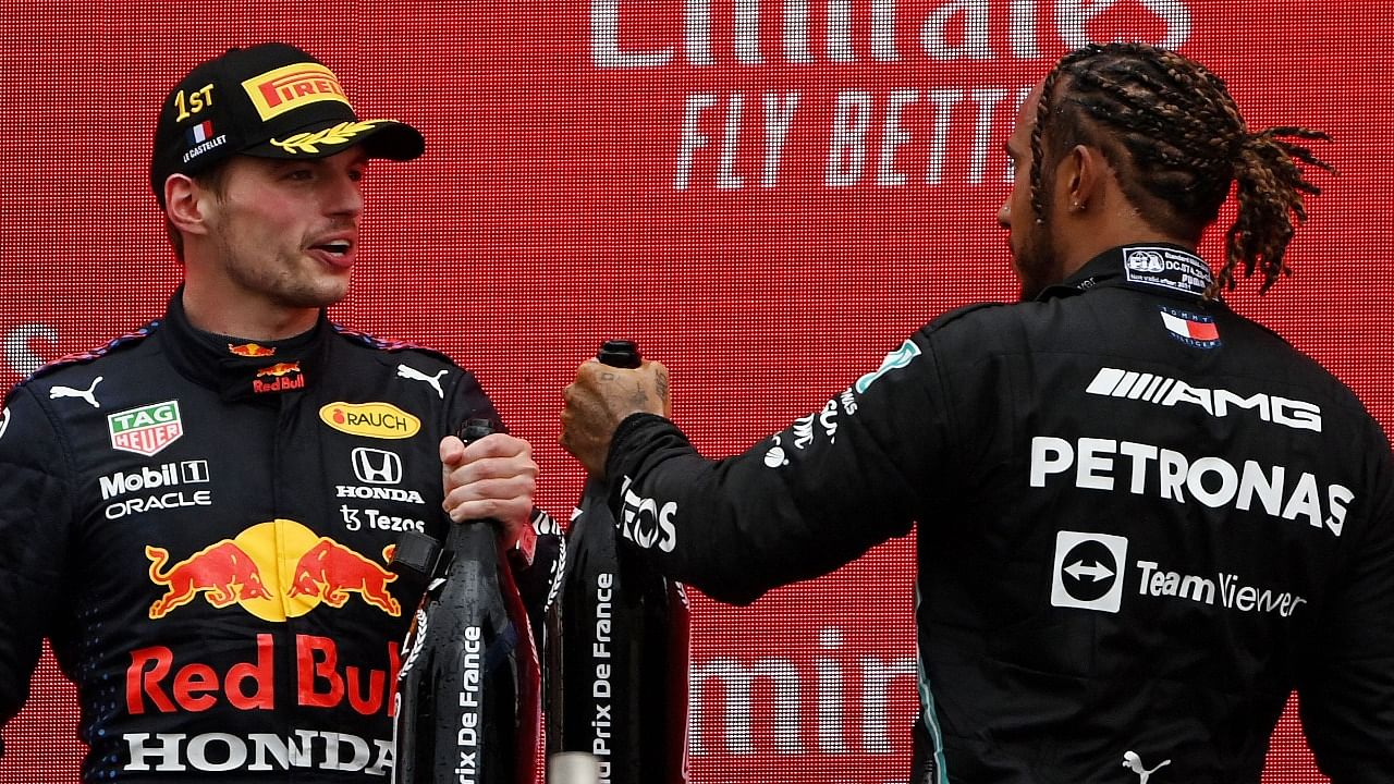 Mercedes' British driver Lewis Hamilton (R) and Red Bull's Dutch driver Max Verstappen. Credit: AFP Photo