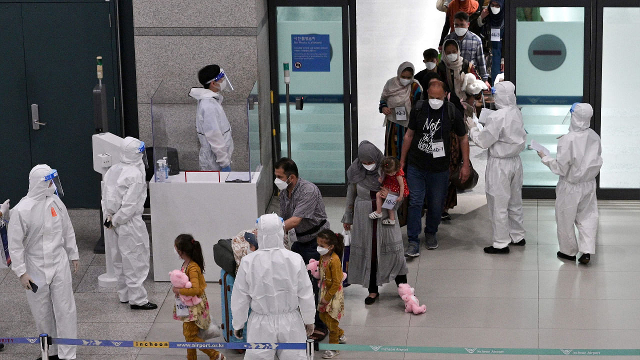 Afghan evacuees arrive at Incheon International Airport outside Seoul. Credit: AFP Photo