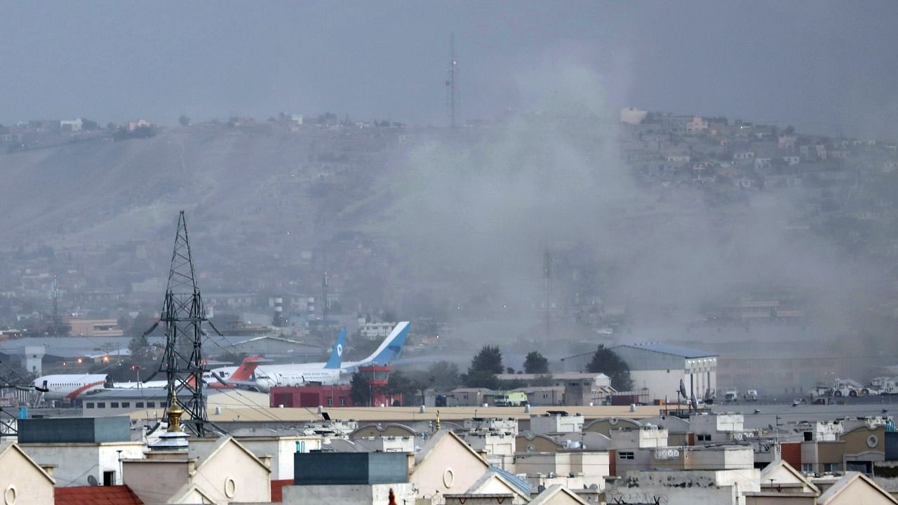 Smoke rises from a deadly explosion outside the airport in Kabul. Credit: AP Photo