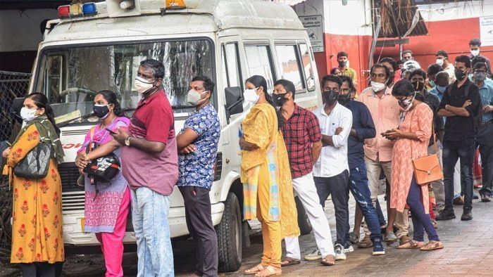 Beneficiaries wait in a queue to receive Covid-19 vaccine dose, at Eranamkulam General Hospital in Kochi, Thursday, August 12, 2021. Credit: PTI Photo