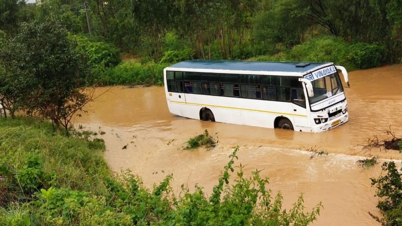 A bus stuck in the deluge at Nandi Cross. Credit: DH photo