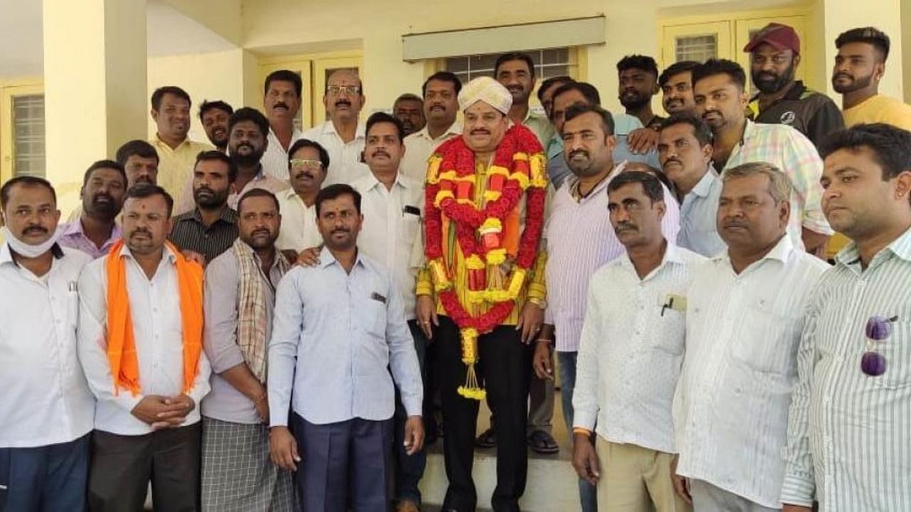 Chairman of Jungle Lodges and Resorts M Appanna seen with his supporters, in T Narasipur, in Mysuru district. Credit: DH file photo