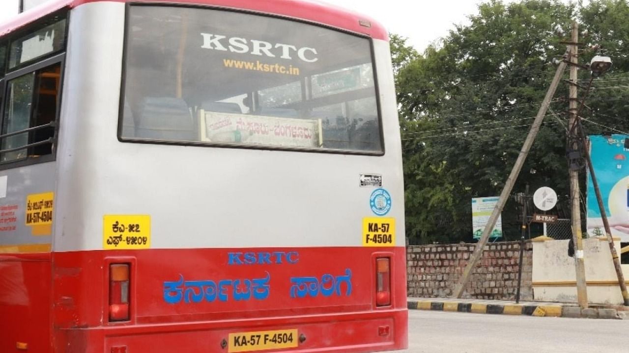 A KSRTC bus driver violates no entry for KSRTC buses rule on Bengaluru-Mysuru Road. The image on the signboard are not clearly visible. Credit: DH Photo/Aisworya S Cuty