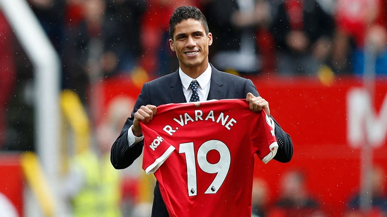 Manchester United's Raphael Varane is presented to the fans ahead of the English Premier League football match between Manchester United and Leeds United at Old Trafford in Manchester, north west England, on August 14, 2021. Credit: AFP Photo