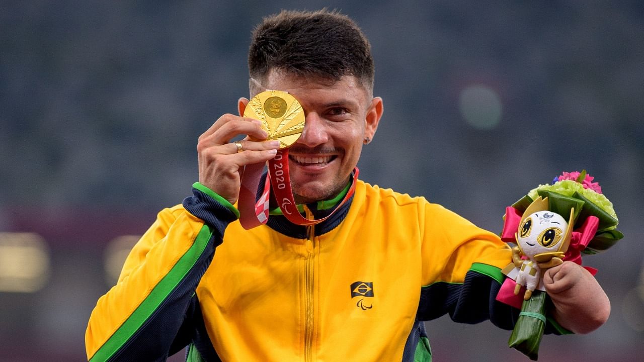Petrucio Ferreira Dos Santos of Brazil holds his Gold Medal. Credit: AP Photo