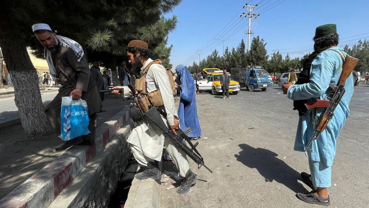 Taliban forces block the roads around the airport in Kabul, Afghanistan. Credit: Reuters Photo