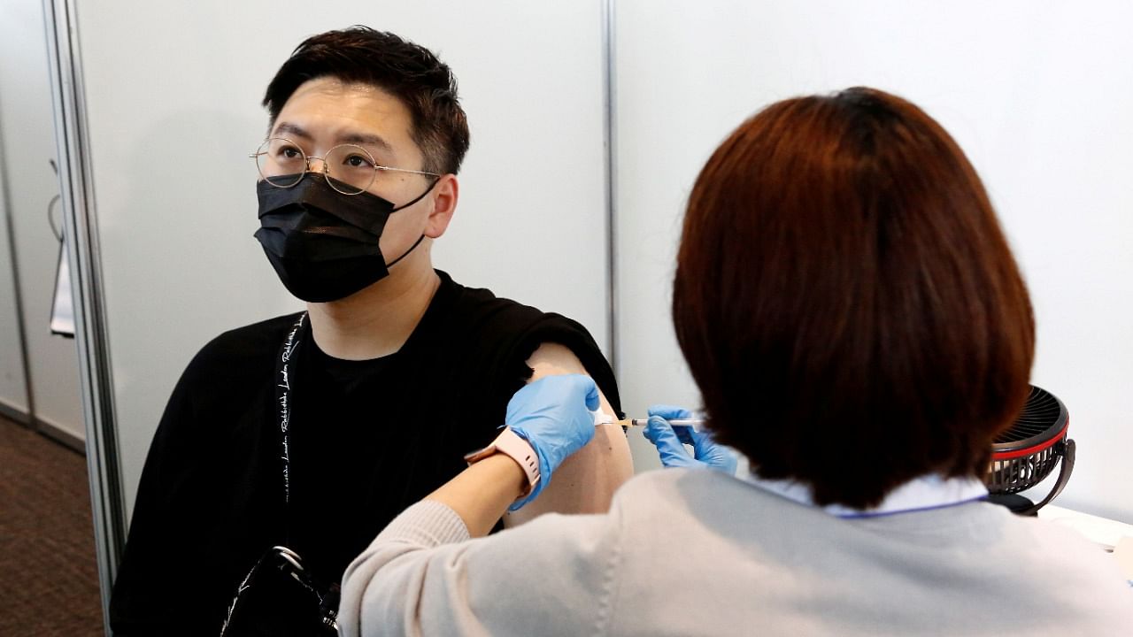 A man receives the Moderna coronavirus vaccine at the Tokyo Metropolitan Government building in Tokyo. Credit: Reuters File Photo