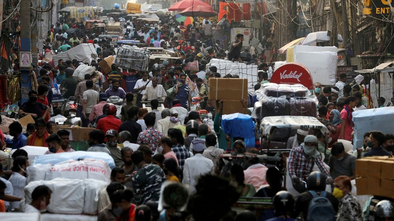 People walk at a crowded market in the old quarters of Delhi, India, April 6, 2021. Credit: Reuters File Photo