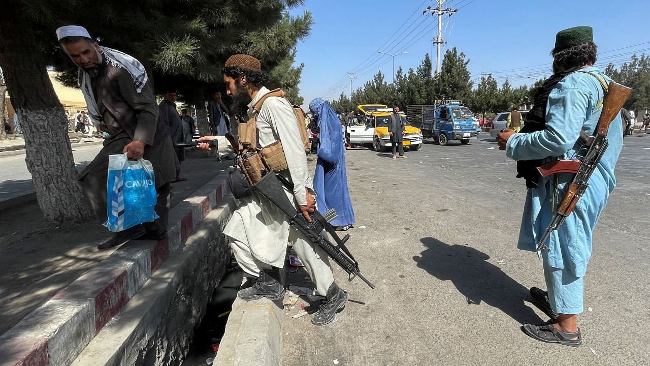 Taliban forces block the roads around the airport in Kabul. Credit: Reuters Photo
