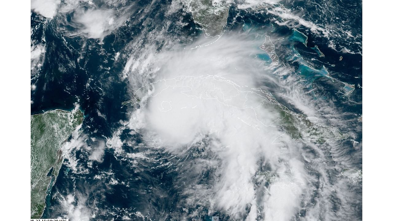 This RAMMB National Oceanic and Atmospheric Administration(NOAA) satellite handout image shows Hurricane Ida (C) at 17:40 UTC, on August 27, 2021. Credit: AFP photo/RAMMB/NOAA/Handout