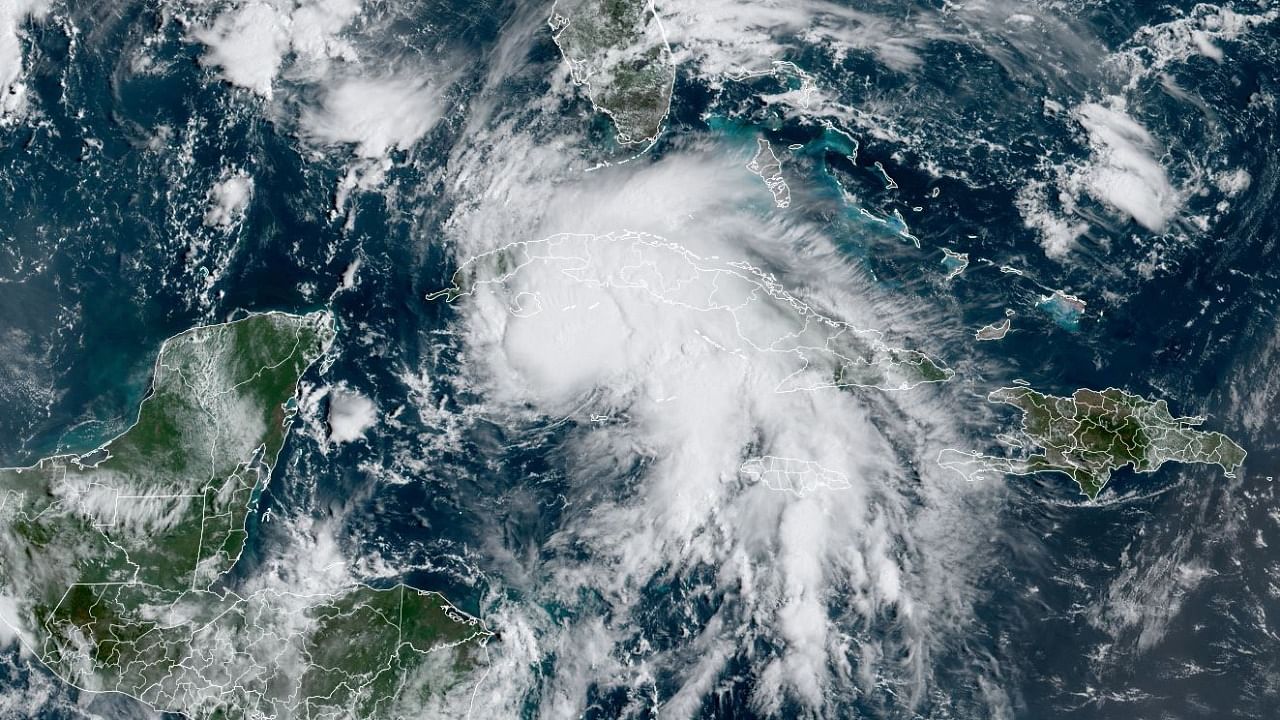This RAMMB National Oceanic and Atmospheric Administration (NOAA) satellite handout image shows Tropical Storm Ida (C) at 14:30 UTC, on August 27, 2021. Credit: AFP Photo/RAMMB/NOAA/Handout