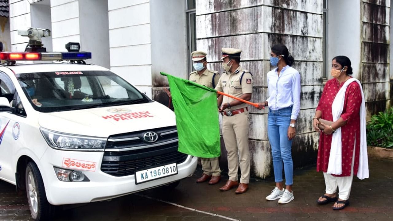 Olympian M R Poovamma flaggs off emergency response support system (ERSS) 112 vehicle at City Police Commissioner's office in Mangaluru on Saturday. Credit: DH Photo/Irshad Mahammad