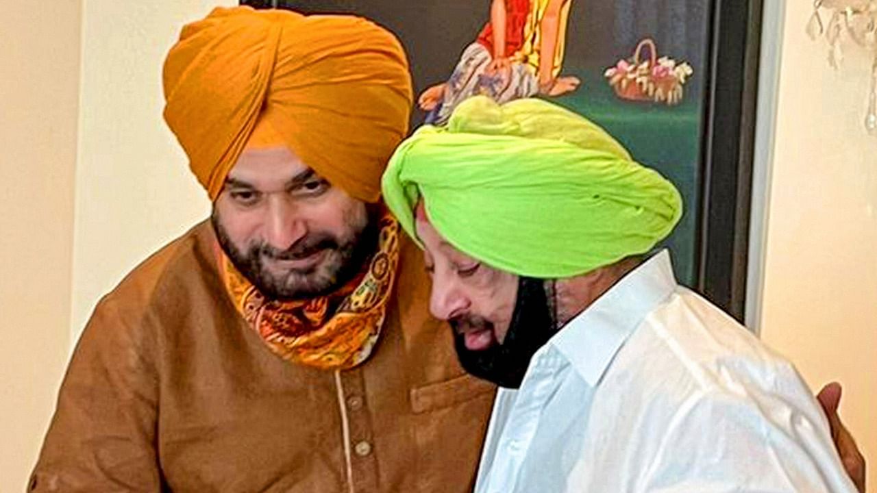 Punjab CM Captain Amarinder Singh with State Congress chief Navjot Singh Sidhu during a meeting in Chandigarh, Friday. Credit: PTI File Photo