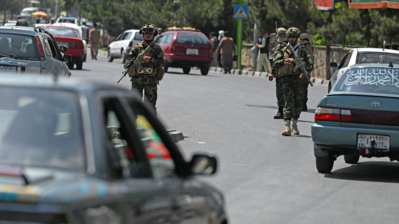 Taliban Fateh fighters, a "special forces" unit, patrol along a street in Kabul. Credit: AFP Photo