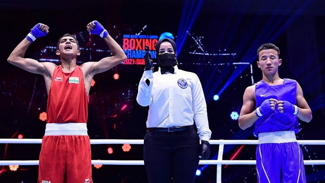India's Rohit Chamoli (in red) celebrates his win against Mongolia’s Otgonbayar Tuvshinzaya in their final bout at the ASBC Asian Junior Boxing Championships in Dubai on Sunday, Aug 29, 2021.