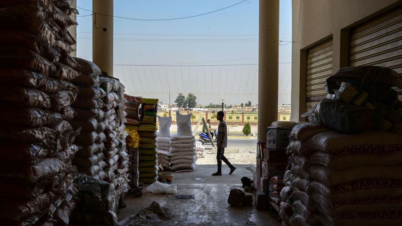 A shopkeeper works at wholesale foodstuffs store at the Cornish shopping street in Iraq's second city of Mosul, in the northern Nineveh province. Credit: AFP Photo