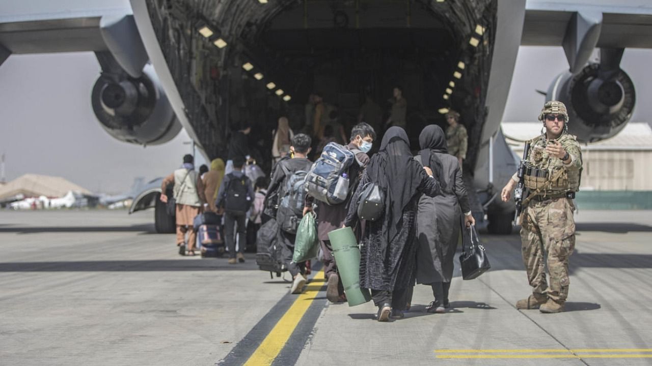 Evacuation underway at Kabul airport. Credit: AP File Photo