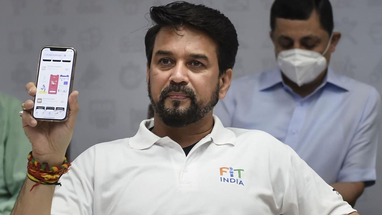 Union Minister of for I&B and Youth Affairs & Sports, Anurag Thakur shows mobile after launching the FIT India APP in New Delhi. Credit: PTI Photo