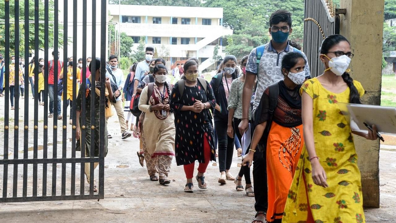 Students come out of Mothi Veerappa College after appearing for CET exam in Davangere on Sunday. Credit: DH photo